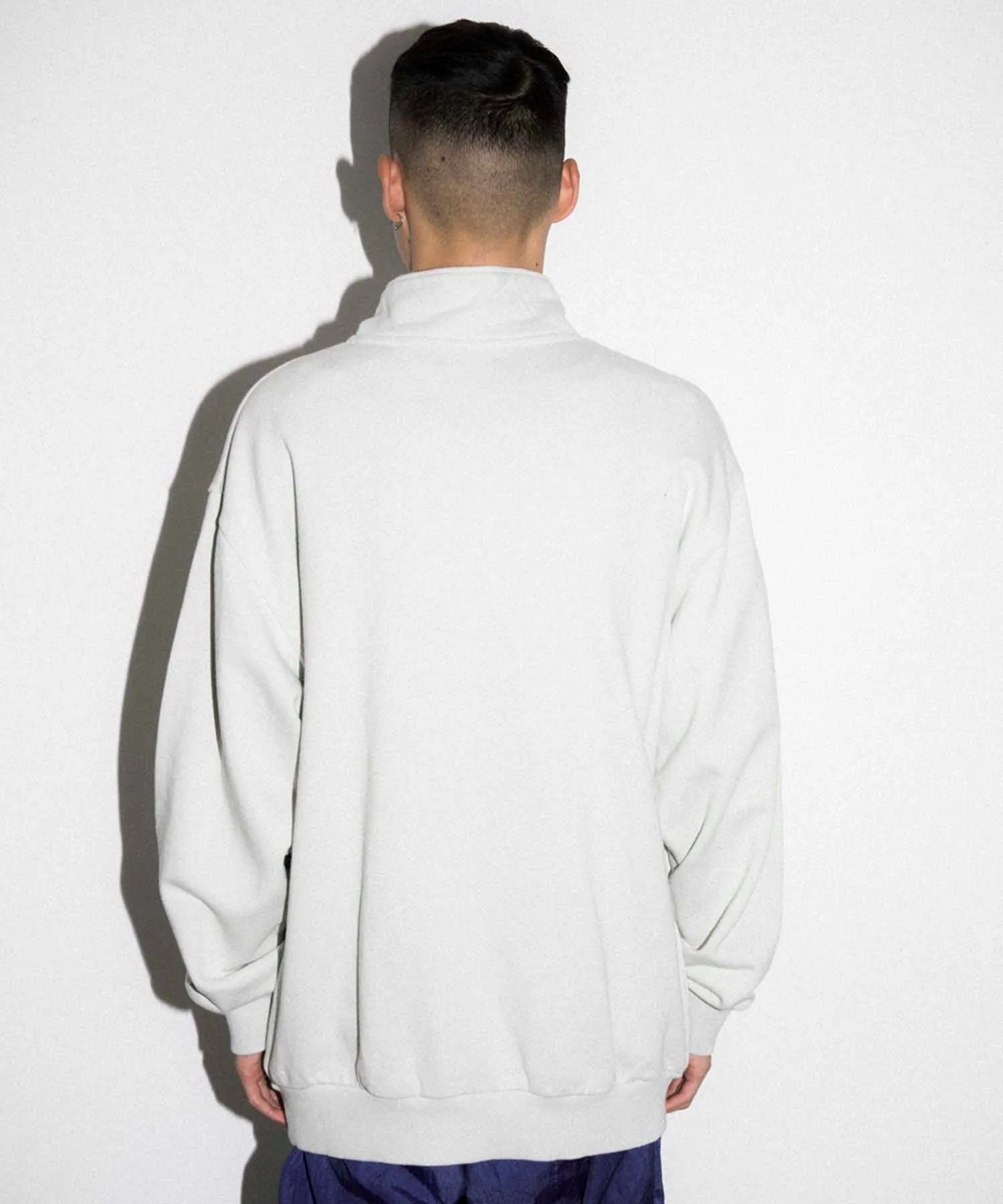 EMBROIDERY LASER HALF ZIP SWEAT